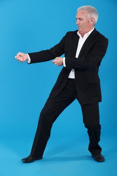 Businessman tugging invisible rope