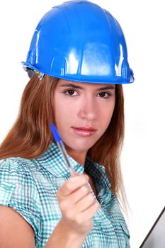 Woman in a hardhat with a clipboard