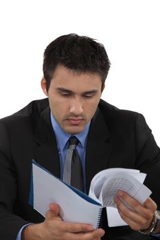 A businessman reading notes.