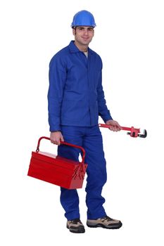 Worker with a wrench and toolbox