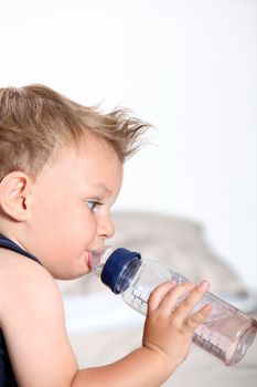 cute baby boy with bottle