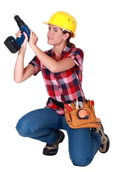 craftswoman holding a drill