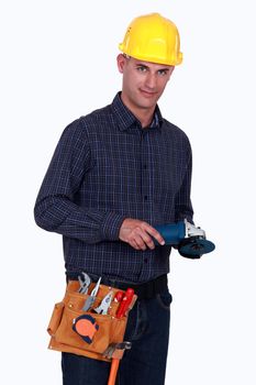 Tradesman holding an angle grinder