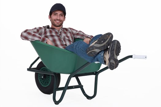 Man with a wheelbarrow.