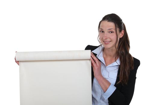 Businesswoman with a roll of blank paper