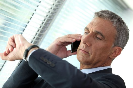 Businessman looking at his watch