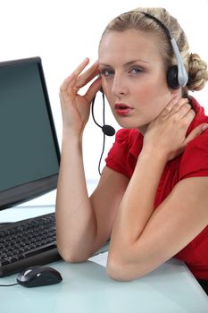 Blond receptionist suffering from headache