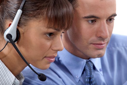 Close up of a business couple with a headset