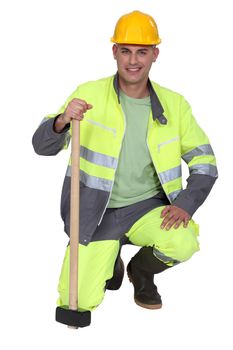 portrait of bricklayer all smiles with safety outfit