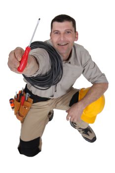 Electrician offering screwdriver
