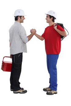 Two artisans greeting each other