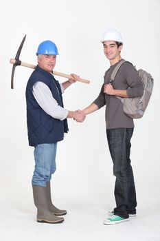 Experienced tradesman meeting his new apprentice for the first time