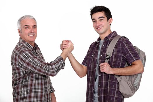 Experienced handyman greeting new starter