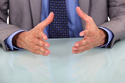 closeup on businessman's hands during speech