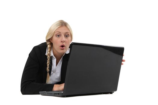 Woman surprised in front of a computer