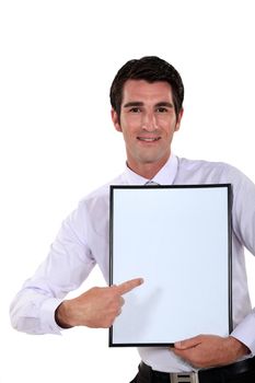 Man holding up a blank bulletin board