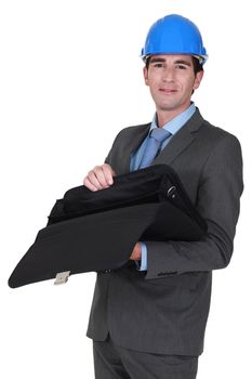 businessman wearing helmet opening his briefcase