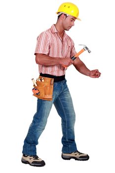 Tradesman using a hammer