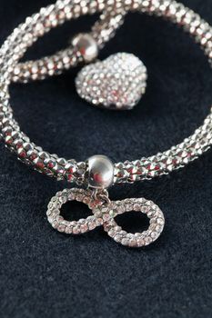 Bracelet of little stones with infinity symbol