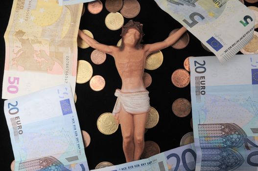 Jesus Christ and Money on a Dark Background - Religion Concept