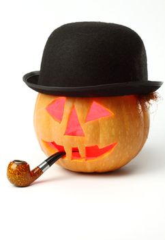 Halloween Jack o Lantern with a tobaco pipe and bowler