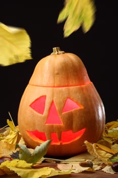 Halloween Jack o Lantern and falling leaves