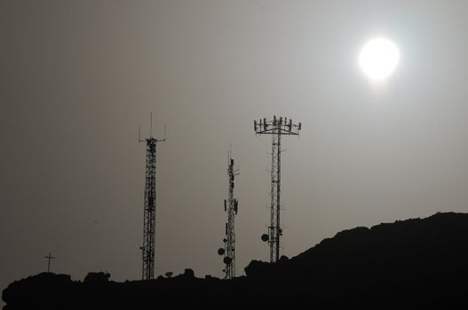 Some Silhouetted Antennas on the top of a Hill