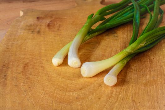 Spring Green Onions Group On Wooden Desk