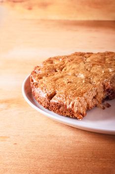 Homemade Cake With Cut Piece On Wooden Table