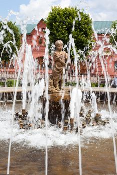 Statue of a little girl in the fountain
