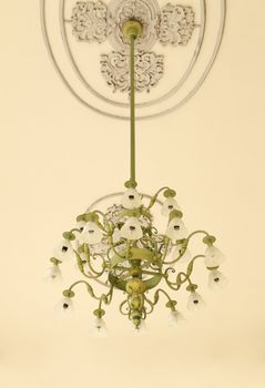 beautiful vintagel chandelier hanging under a ceiling