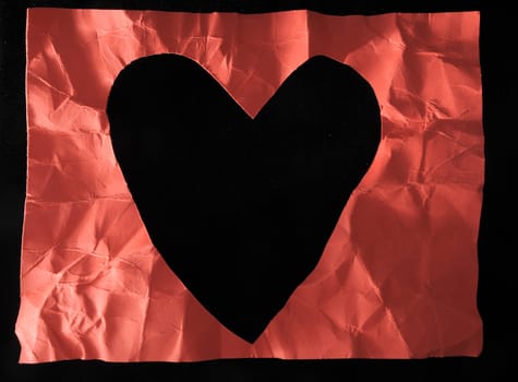 Grunge Red Paper Heart on a Black Background