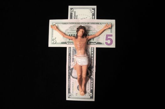 Jesus Christ and Money on a Dark Background - Religion Concept