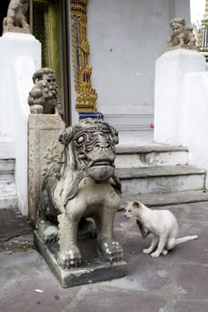 Ancient stone carved statue in a Thai temple