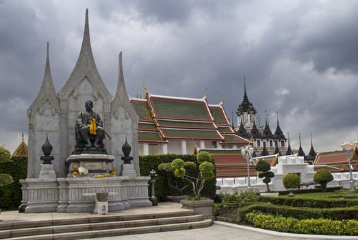 Statue of Rama III with Wat Ratchanadda and the Loha Prasat in the background, Bangkok, Thailand