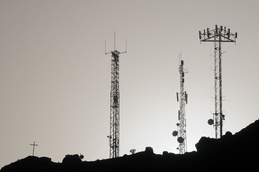 Some Silhouetted Antennas on the top of a Hill