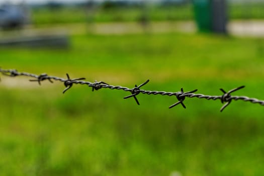 barbed wire defending the industries