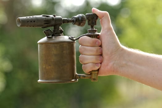 close-up of a antique gasoline welder from second worl war