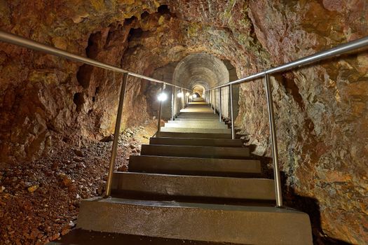 Mining tunnel with lights and rails