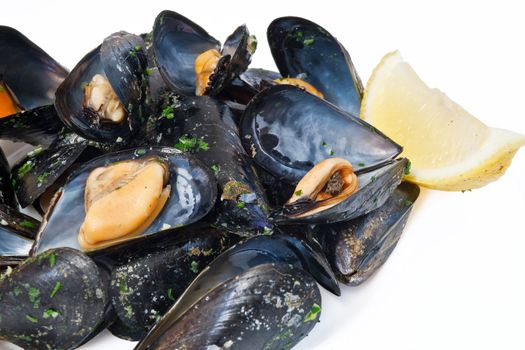 typical mediterranean dish: boiled mussels with garlic parsley and lemon