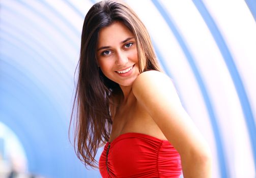 Beautiful young woman in a red dress