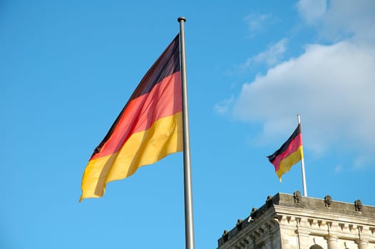 German flags over Reichstag in Berlin Germany