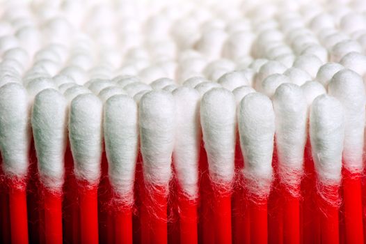 symmetrical rows of clean cotton swabs red