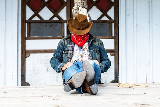 SOUTH WEST - A cowboy takes time to rest and reflect.