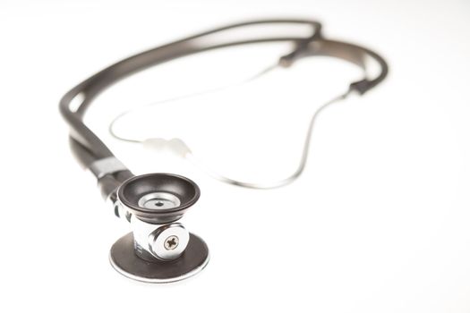 Stethoscope on isolated white background, shallow DOF