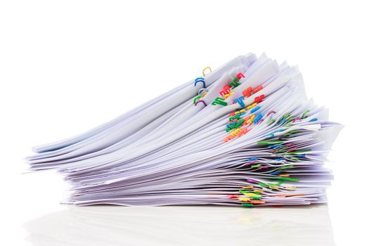 Stack of documents with colorful clips isolated on white background