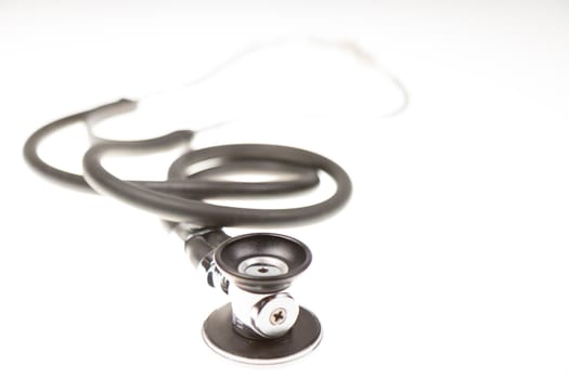 Stethoscope on isolated white background, shallow DOF