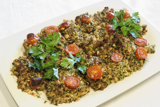 Pieces of roasted salmon with crushed dried bread with spices