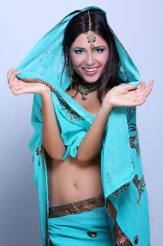 young pretty woman in indian turquoise sari