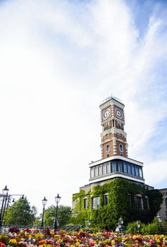 Clock tower with colorful flower garden1